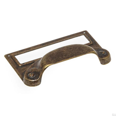 Un tirador de mueble de concha con la etiqueta Antique Bronze