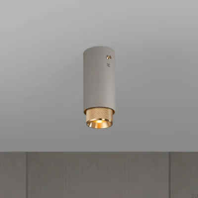 Lámpara de techo con foco de latón y acabado en acero gris con forma de cruz de escape