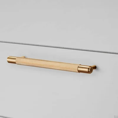 Tirador alargado para muebles Cross 325 de latón