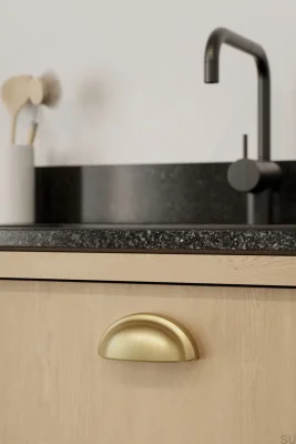 Tirador de mueble Baron 64 de metal con acabado dorado oscuro cepillado